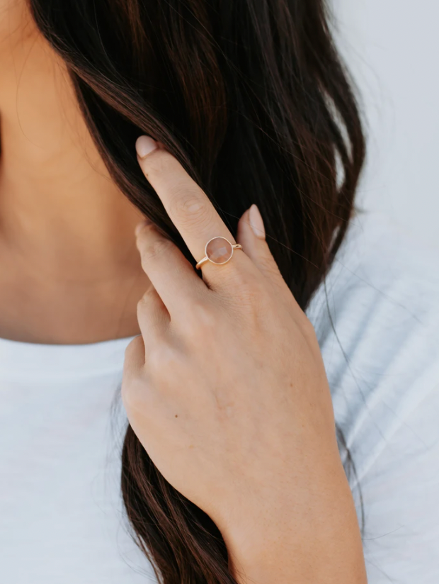 Gold ring with circle cut pink stone